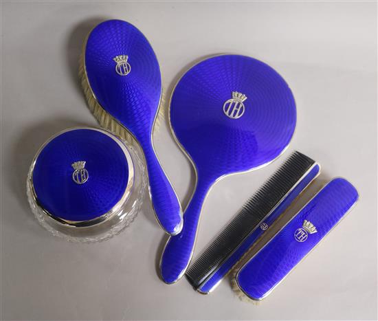 A matched five-piece blue guilloche enamel and silver dressing table set,